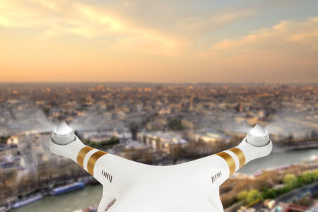 Drone flying above Paris city panorama in sunsetの写真素材