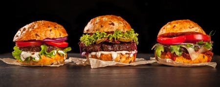 Fresh home-made hamburgers served on stone tableの写真素材