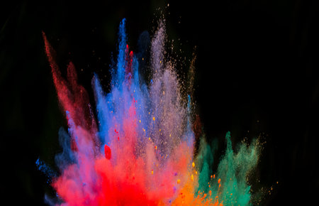 Explosion of colored powder, isolated on black background