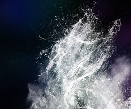 Abstract shape of water splash with powder isolated on black background
