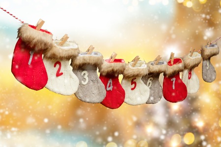 Advent calendar made of socks, abstract blurred lights on backgroundの写真素材