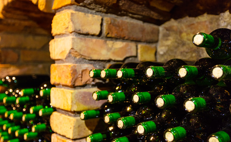 Many bottles in wine cellar, side view, low depth of focusの写真素材
