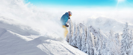 Skier on piste running downhill in beautiful Alpine landscape. Blue sky on background. Free space...