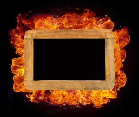 Old wooden small chartboard in fire with free space for textの写真素材