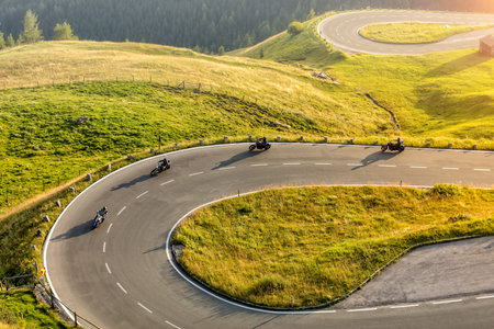 Motorcycle drivers riding in Alpine highway,  Hochalpenstrasse, Austria, Europe. Outdoor...
