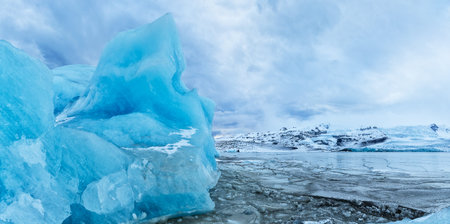 Iceberg lagoon in Fjallsarlon, Iceland. Beautiful sunset light, concept of global warming and ice...