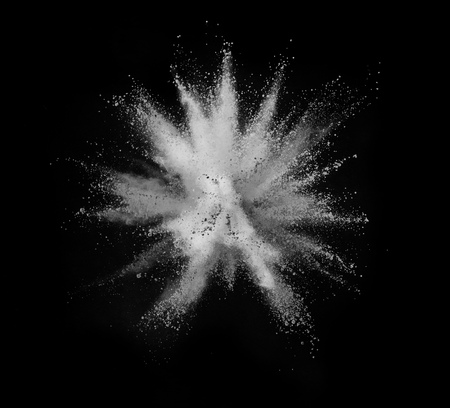White powder explosion isolated on black background.の写真素材