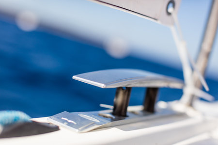 Detail of sailing yacht rope cleat, low depth of focus. Leasure activities and extreme sport. Low...