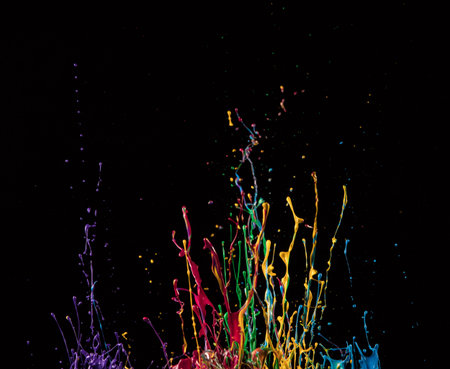 Macro photo of mixed acryl colors isolated on black background. Abstract coloured background.