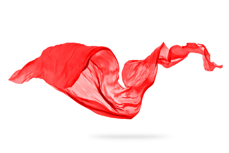 Flying piece of colored cloth texture isolated on whiteの写真素材