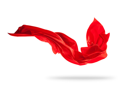 Flying piece of colored cloth texture isolated on whiteの写真素材