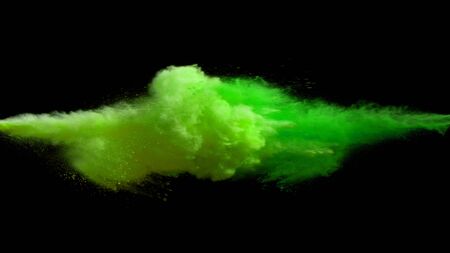 Collision of colored powder isolated on black background. Abstract colored backgroundの写真素材