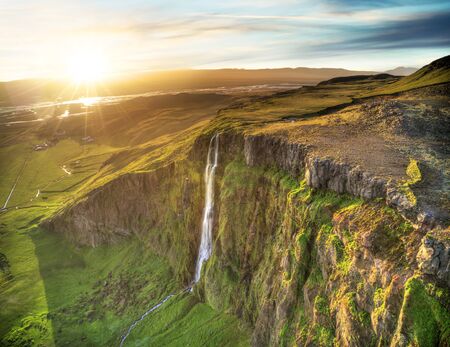 Dramatic top view of waterfall peak, Iceland. Iceland is famous for pure, dramatic and rough nature.の写真素材