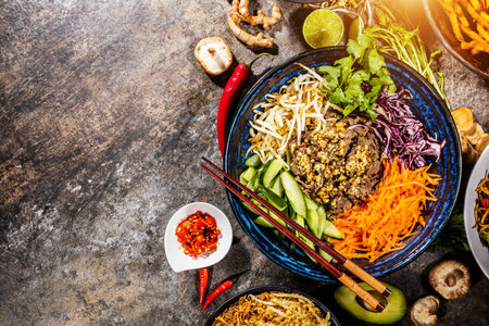 Top view composition of various Asian food in bowls, free space for text