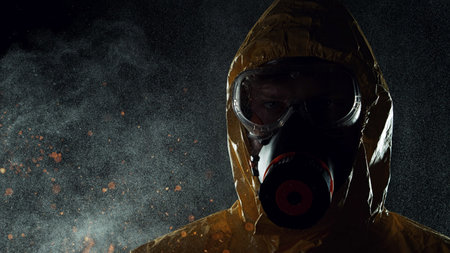 Portrait of a man in chemical suit with respirator and goggles. Concept of protection against...