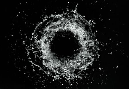 Abstract twister shape of water splash, isolated on blackの写真素材