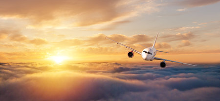 Commercial airplane flying over dramatic sunset sky. Jet plane is the fastest mode of modern...