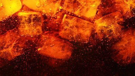 Detail of cola drink with ice cubes, fresh beverages background.の写真素材