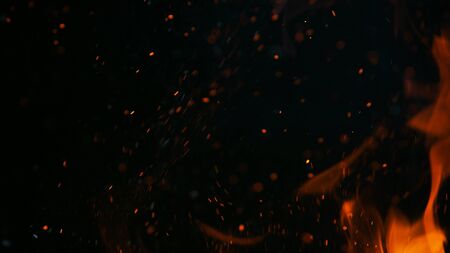 Close up of fire isolated on blackの写真素材
