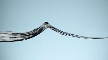 Closeup of water waves isolated on blue background, studio macro shot.の写真素材