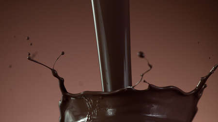 Closeup of splashing hot chocolate, freeze motionの写真素材