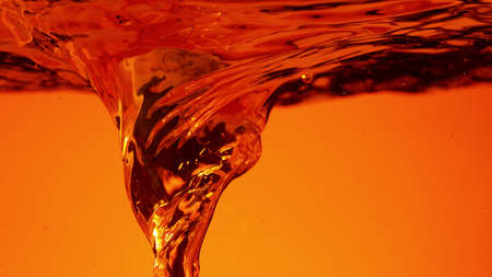 Abstract whirl shape of oil or alcoholic liquid, closeup.の写真素材
