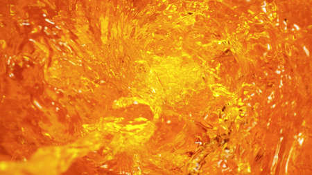 Rippling water surface in neon blue-pink colors with rain drops.の写真素材