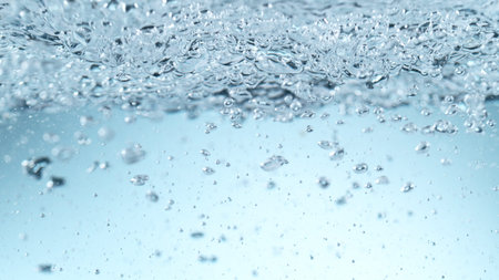 Detail of waving water with bubbles, closeup. Abstract aqua background.
