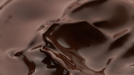 chocolate splash wavy shape, isolated on brown background