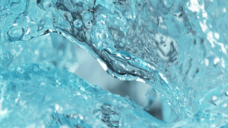 Pouring orange juice with splashing liquid, freeze motion studio shot.