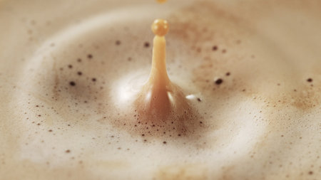 Detail of coffee drink being pour into foamy coffee drink. Abstract coffee background.の写真素材