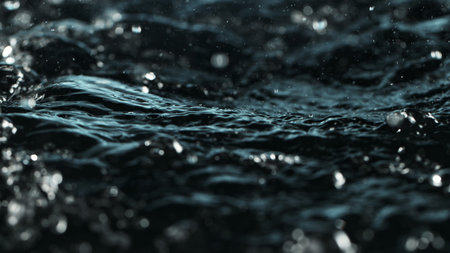 Macro shot of dropping water in dark black colors.