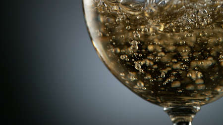 Pouring Glass of scotch whiskey and ice. Freeze motion of splashing liquid.の写真素材