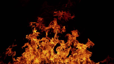 Texture of flames isolated on black background. Fire and fiery element.