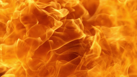 Texture of flames isolated on black background. Fire and fiery element.