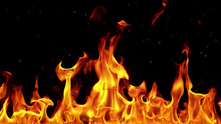 Texture of flames isolated on black background. Fire and fiery element.