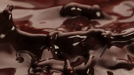 Macro photo of premium dark chocolate splashing. Freeze motion, splashing melted chocolate background.の写真素材