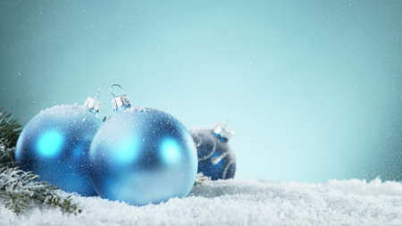 Fir tree branch covered with snow. Isolated on blue backgroundの写真素材