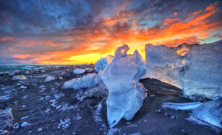 Iceberg lagoon in Fjallsarlon, Iceland. Beautiful sunset light, concept of global warming and ice melting.の写真素材
