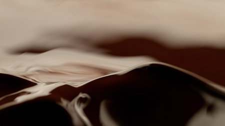 Detail of splashing melted chocolate. Macro shot, food background.