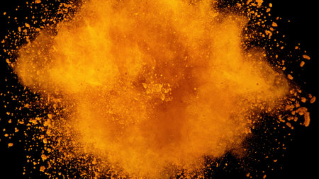 Explosion of brown powder on black background. Freeze motion of abstract shape.の写真素材
