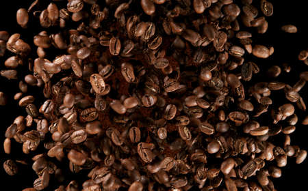 Mix of spices flying on black background. Freeze motion of various kind of dry spice.の写真素材