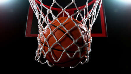 Basketball basket on black backgorund, detail shot, dark background with spot lights.の写真素材