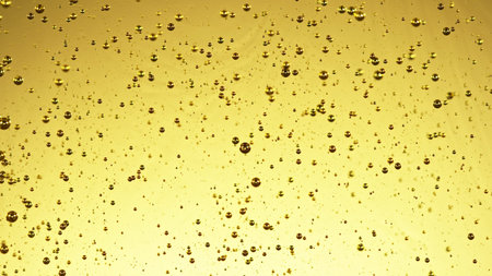 Olive oil drops from green olive berry close up, macro shot. Fresh pressed extra virgin olive oil...
