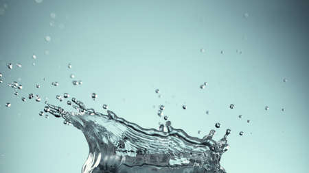 Freeze motion of splashing whiskey. Placed on wooden table.の写真素材