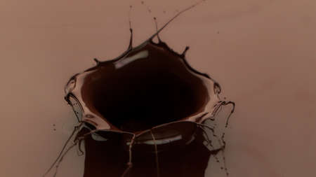 Melted chocolate splash in detail, freeze motion, isolated on black background.. Abstract sweet background.の写真素材