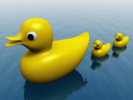 the plastic duck and ducklingsの写真素材