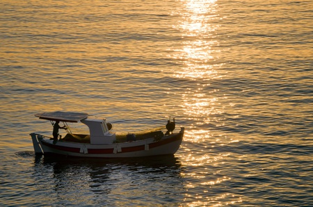 fish boat on the sea in the morningの写真素材
