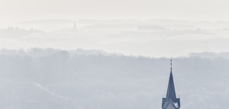 campaign, bell tower and town in winterの写真素材