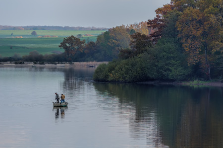Fishermen in a boatの写真素材